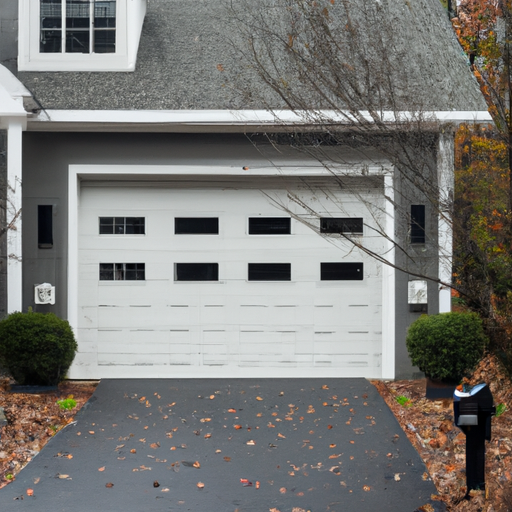 Modern garage door on a Mendham, NJ home with visible smart keypad and tidy driveway, late-fall lighting.