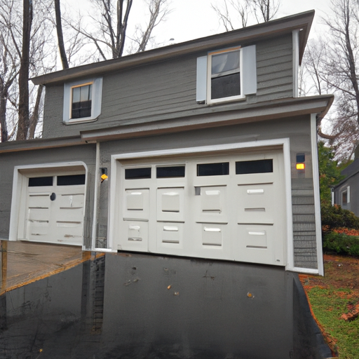 Wide shot of a Mendham, NJ suburban home with a closed modern paneled garage door on an overcast day.